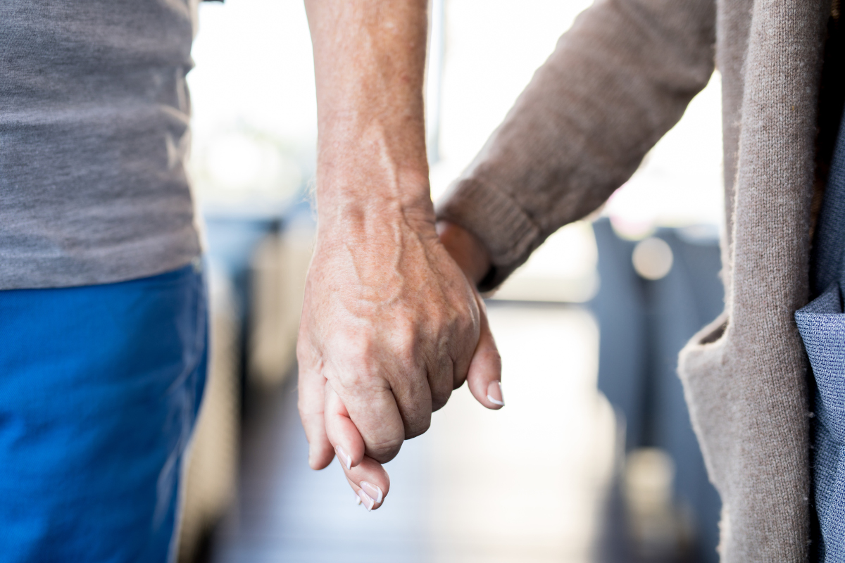 senior-couple-holding-hands-small-size